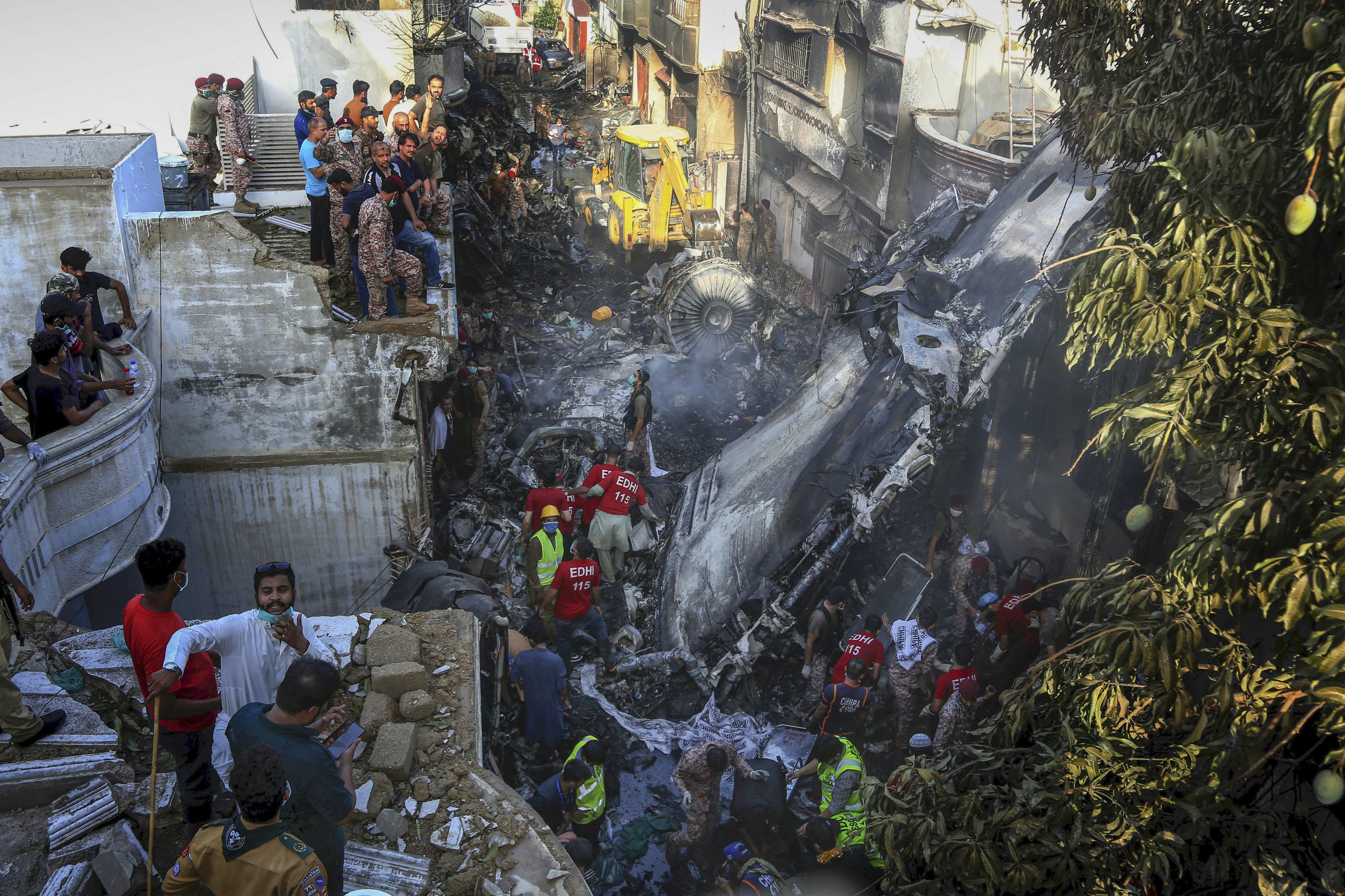 Pakistan jet with 98 aboard crashes in crowded neighborhood