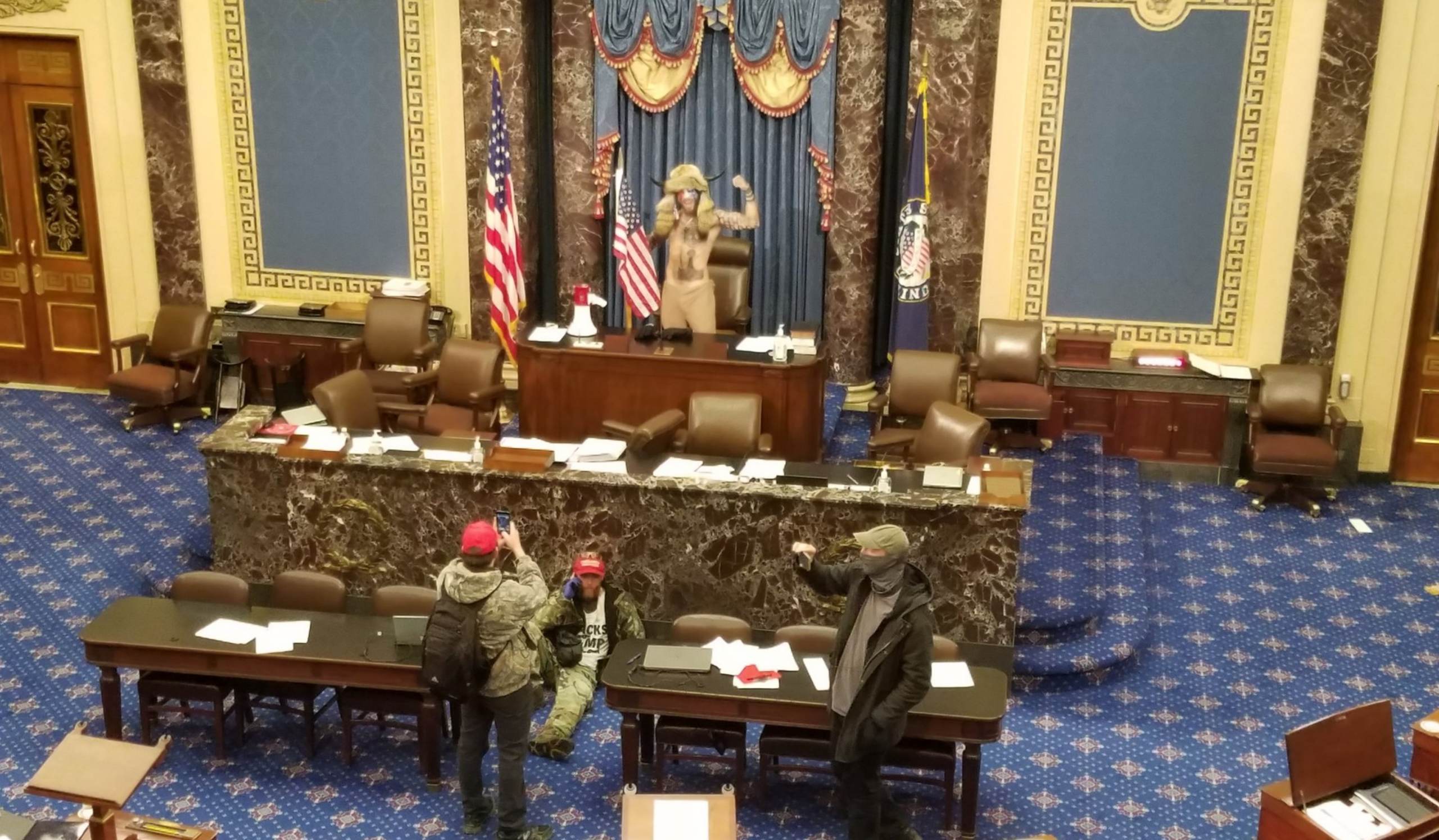 Bare-Chested Man Seen Wearing Horns in Vice President Pence's Chair Arrested on Federal Charges