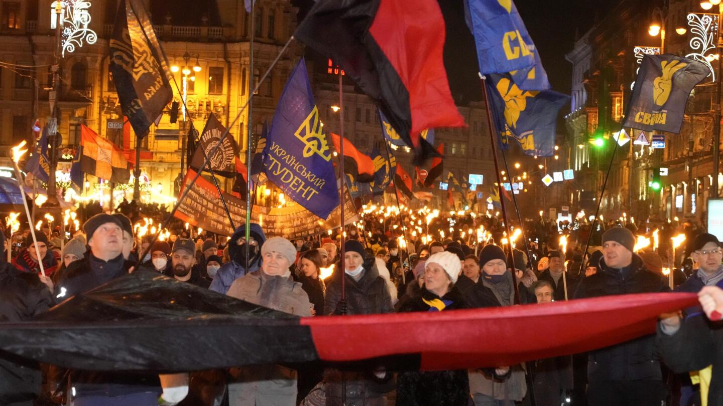 Ukraine nationalists march to honor wartime partisan leader | AP News